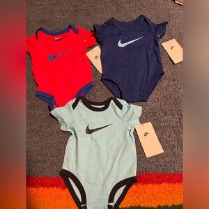 🍕Three brand new with tags Nike onesies